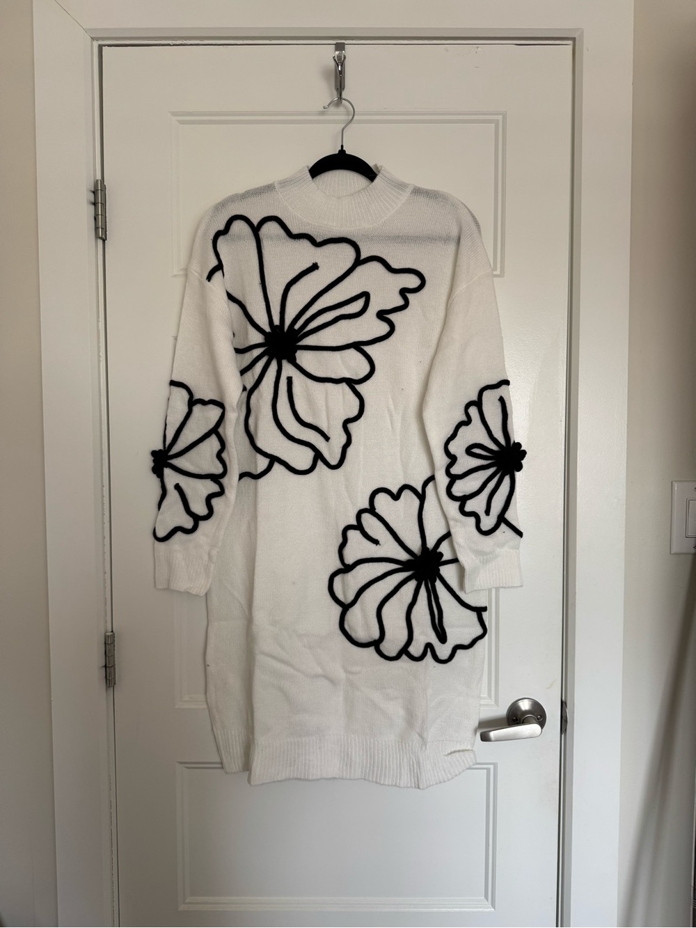 White Knit Sweater Dress with Bold Black Floral Appliqué